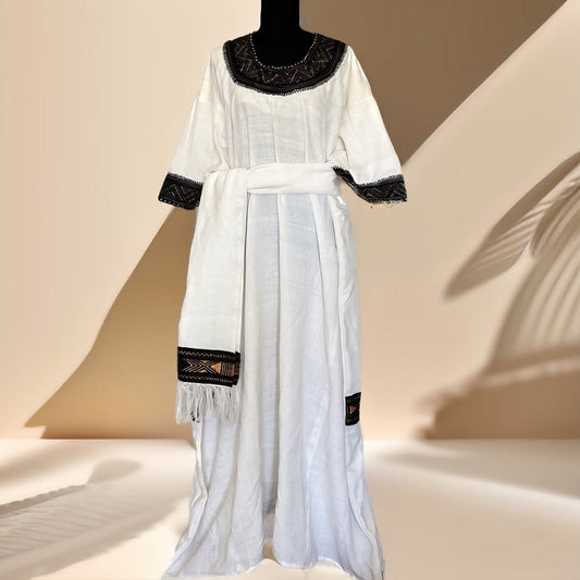 Megaleye • መጋልዬ Ethiopian Raya Wollo Traditional White Zirg Tilf Gumaj (ዝርግ ጥልፍ ጉማጅ) Dress